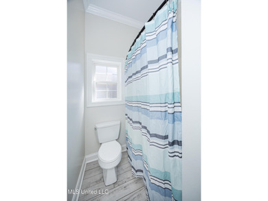 Elegant updated home in the highly sought after Diamondhead on Diamondhead Country Club in Mississippi - for sale on GolfHomes.com, golf home, golf lot