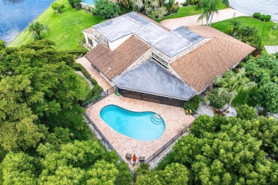 Rare 4-Bedroom CBS Home in Eastpointe with 160' of Breathtaking on Eastpointe Country Club in Florida - for sale on GolfHomes.com, golf home, golf lot