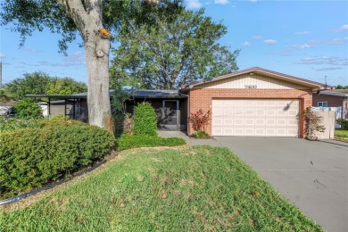 This well maintained concrete block corner home sustained flood on Mangrove Bay Golf Course in Florida - for sale on GolfHomes.com, golf home, golf lot