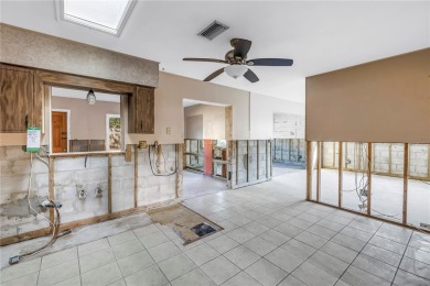 This well maintained concrete block corner home sustained flood on Mangrove Bay Golf Course in Florida - for sale on GolfHomes.com, golf home, golf lot