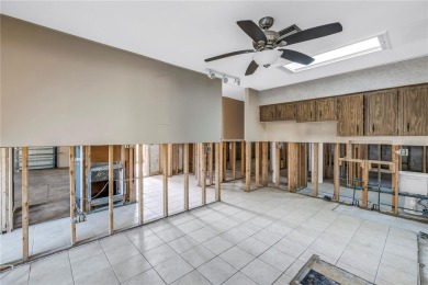 This well maintained concrete block corner home sustained flood on Mangrove Bay Golf Course in Florida - for sale on GolfHomes.com, golf home, golf lot