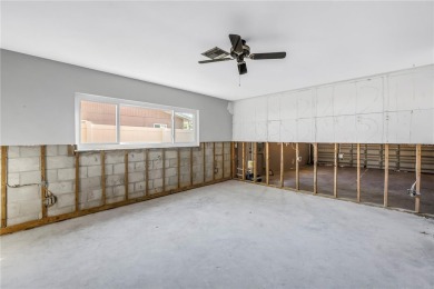 This well maintained concrete block corner home sustained flood on Mangrove Bay Golf Course in Florida - for sale on GolfHomes.com, golf home, golf lot