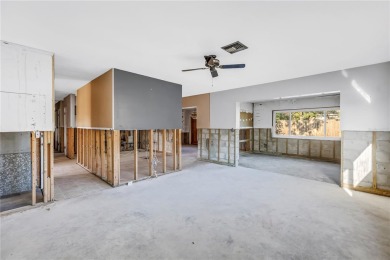 This well maintained concrete block corner home sustained flood on Mangrove Bay Golf Course in Florida - for sale on GolfHomes.com, golf home, golf lot