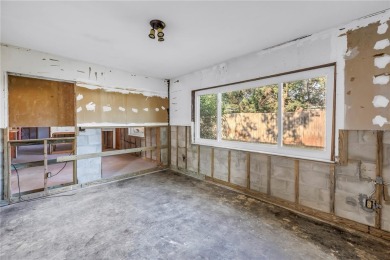 This well maintained concrete block corner home sustained flood on Mangrove Bay Golf Course in Florida - for sale on GolfHomes.com, golf home, golf lot