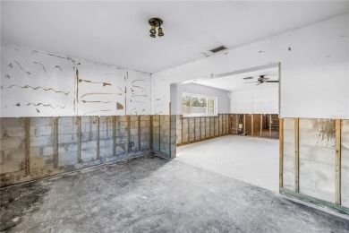 This well maintained concrete block corner home sustained flood on Mangrove Bay Golf Course in Florida - for sale on GolfHomes.com, golf home, golf lot