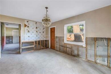 This well maintained concrete block corner home sustained flood on Mangrove Bay Golf Course in Florida - for sale on GolfHomes.com, golf home, golf lot