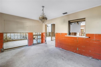 This well maintained concrete block corner home sustained flood on Mangrove Bay Golf Course in Florida - for sale on GolfHomes.com, golf home, golf lot