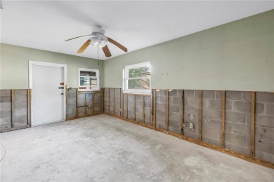 This well maintained concrete block corner home sustained flood on Mangrove Bay Golf Course in Florida - for sale on GolfHomes.com, golf home, golf lot