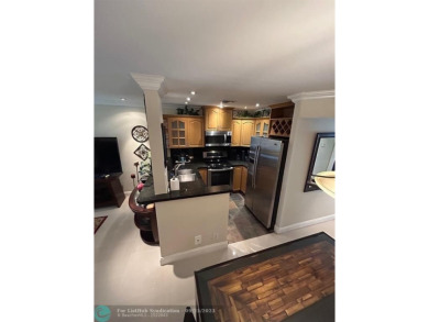 This 1Bed, 1Bath condo has an updated kitchen with granite on Sunrise Lakes Phase III in Florida - for sale on GolfHomes.com, golf home, golf lot