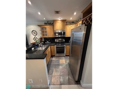 This 1Bed, 1Bath condo has an updated kitchen with granite on Sunrise Lakes Phase III in Florida - for sale on GolfHomes.com, golf home, golf lot