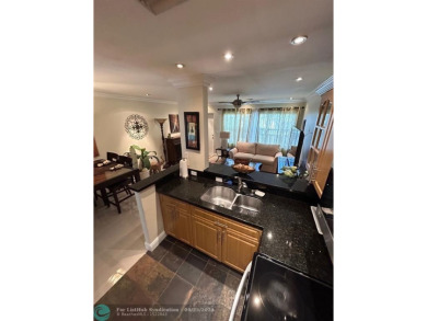 This 1Bed, 1Bath condo has an updated kitchen with granite on Sunrise Lakes Phase III in Florida - for sale on GolfHomes.com, golf home, golf lot