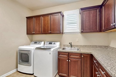 Beautifully positioned on a corner lot, this elegant Rialta home on Wildhorse Golf Club of Robson Ranch in Texas - for sale on GolfHomes.com, golf home, golf lot
