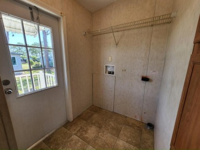 Make your new home in Lake Fairways, a well-maintained on Pine Lakes Country Club in Florida - for sale on GolfHomes.com, golf home, golf lot