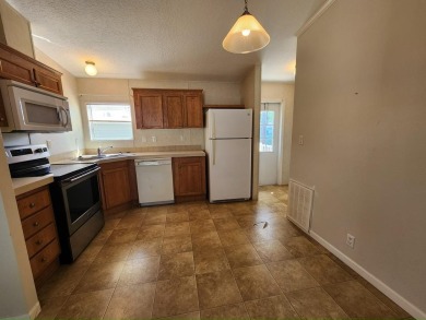 Make your new home in Lake Fairways, a well-maintained on Pine Lakes Country Club in Florida - for sale on GolfHomes.com, golf home, golf lot