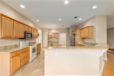 This updated Bridgeport Designer home with a golf cart garage is on Glenview Championship Golf and Country Club in Florida - for sale on GolfHomes.com, golf home, golf lot