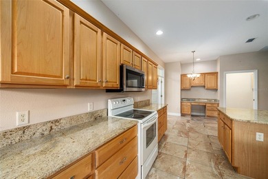 This updated Bridgeport Designer home with a golf cart garage is on Glenview Championship Golf and Country Club in Florida - for sale on GolfHomes.com, golf home, golf lot