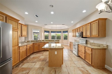This updated Bridgeport Designer home with a golf cart garage is on Glenview Championship Golf and Country Club in Florida - for sale on GolfHomes.com, golf home, golf lot