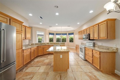 This updated Bridgeport Designer home with a golf cart garage is on Glenview Championship Golf and Country Club in Florida - for sale on GolfHomes.com, golf home, golf lot