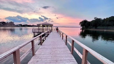 Enjoy the best of lake living on two beautifully treed lots on Links At Lands End in Texas - for sale on GolfHomes.com, golf home, golf lot