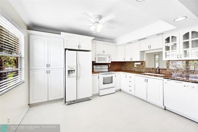 ARUBA VILLAGE IN THE HEART OF WYNMOOR WITH PANORAMIC GOLF COURSE on Wynmoor Golf Course in Florida - for sale on GolfHomes.com, golf home, golf lot