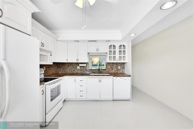 ARUBA VILLAGE IN THE HEART OF WYNMOOR WITH PANORAMIC GOLF COURSE on Wynmoor Golf Course in Florida - for sale on GolfHomes.com, golf home, golf lot