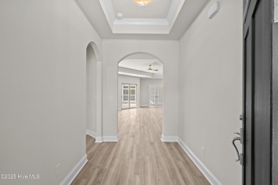 Ranch living at its best in this Promenade III Plan with on Ocean Ridge Plantation in North Carolina - for sale on GolfHomes.com, golf home, golf lot