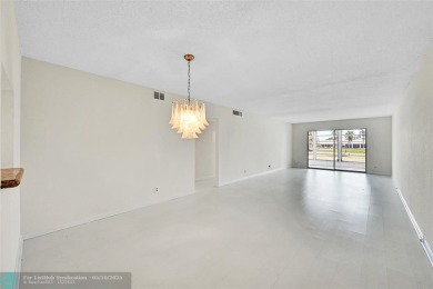 ARUBA VILLAGE IN THE HEART OF WYNMOOR WITH PANORAMIC GOLF COURSE on Wynmoor Golf Course in Florida - for sale on GolfHomes.com, golf home, golf lot