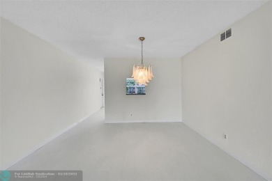 ARUBA VILLAGE IN THE HEART OF WYNMOOR WITH PANORAMIC GOLF COURSE on Wynmoor Golf Course in Florida - for sale on GolfHomes.com, golf home, golf lot