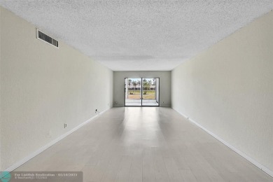ARUBA VILLAGE IN THE HEART OF WYNMOOR WITH PANORAMIC GOLF COURSE on Wynmoor Golf Course in Florida - for sale on GolfHomes.com, golf home, golf lot