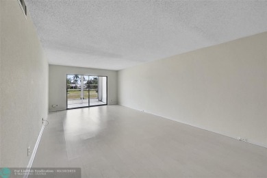 ARUBA VILLAGE IN THE HEART OF WYNMOOR WITH PANORAMIC GOLF COURSE on Wynmoor Golf Course in Florida - for sale on GolfHomes.com, golf home, golf lot