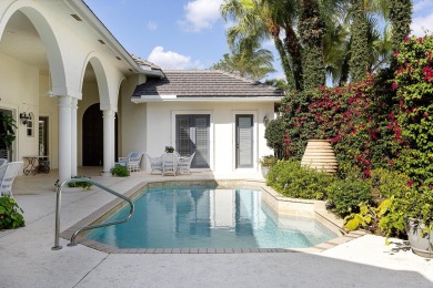 This beautiful courtyard home features four bedrooms on Palm Beach Polo and Country Club in Florida - for sale on GolfHomes.com, golf home, golf lot