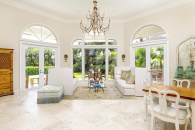 This beautiful courtyard home features four bedrooms on Palm Beach Polo and Country Club in Florida - for sale on GolfHomes.com, golf home, golf lot