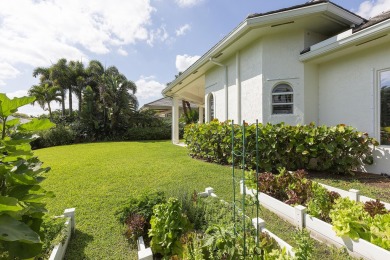 This beautiful courtyard home features four bedrooms on Palm Beach Polo and Country Club in Florida - for sale on GolfHomes.com, golf home, golf lot