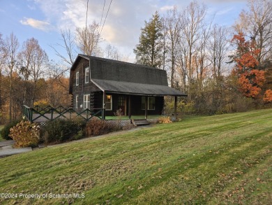 Check out this 3-bedroom, 1-bathroom log home! Featuring a cozy on Rock Creek Golf Course in Pennsylvania - for sale on GolfHomes.com, golf home, golf lot