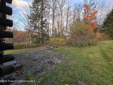 Check out this 3-bedroom, 1-bathroom log home! Featuring a cozy on Rock Creek Golf Course in Pennsylvania - for sale on GolfHomes.com, golf home, golf lot