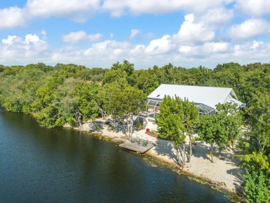 This renovated lakefront home offers comfort, style, and serene on Ocean Reef Club in Florida - for sale on GolfHomes.com, golf home, golf lot