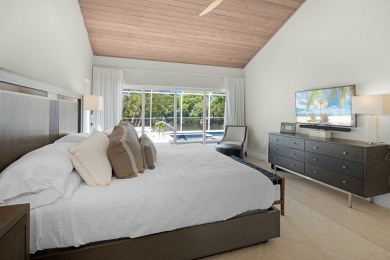 This renovated lakefront home offers comfort, style, and serene on Ocean Reef Club in Florida - for sale on GolfHomes.com, golf home, golf lot