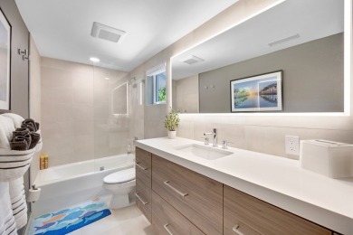 This renovated lakefront home offers comfort, style, and serene on Ocean Reef Club in Florida - for sale on GolfHomes.com, golf home, golf lot
