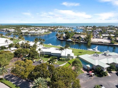 Sleek and modern 1 bedroom/1 bathroom condo with fabulous views on Card Sound Golf Club in Florida - for sale on GolfHomes.com, golf home, golf lot