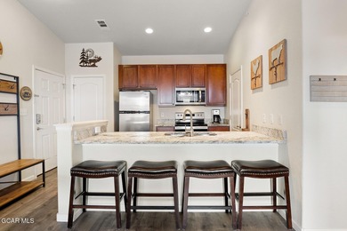 Desirable top floor mountain getaway in Aspen Meadows with full on Headwaters Golf Course At Granby Ranch in Colorado - for sale on GolfHomes.com, golf home, golf lot