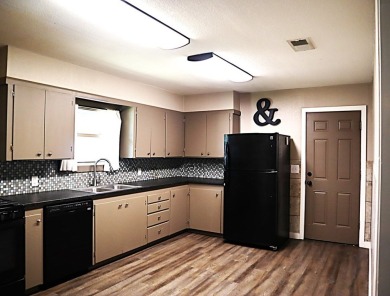 Updated 3 bedroom, 1 bathroom home only blocks from a golf on Sweetwater Country Club in Texas - for sale on GolfHomes.com, golf home, golf lot