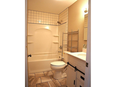 Updated 3 bedroom, 1 bathroom home only blocks from a golf on Sweetwater Country Club in Texas - for sale on GolfHomes.com, golf home, golf lot