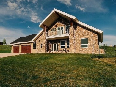 This stunning 4-Bedroom, 2.5 Bath home w/over 2,500 sq ft of on The Powder Horn Golf Club - Mountain in Wyoming - for sale on GolfHomes.com, golf home, golf lot