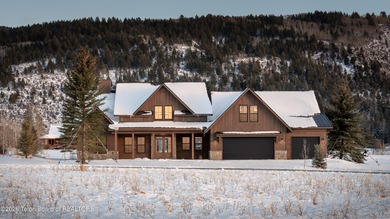 Thoughtfully oriented, this new custom home is designed around on Teton Reserve in Idaho - for sale on GolfHomes.com, golf home, golf lot