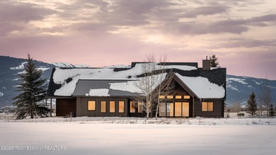 Thoughtfully oriented, this new custom home is designed around on Teton Reserve in Idaho - for sale on GolfHomes.com, golf home, golf lot