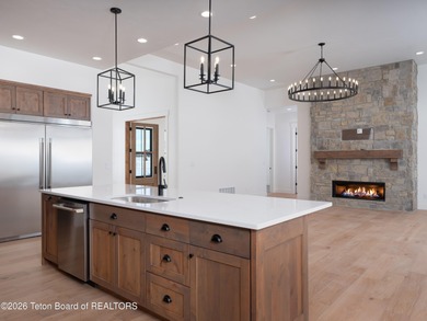 Thoughtfully oriented, this new custom home is designed around on Teton Reserve in Idaho - for sale on GolfHomes.com, golf home, golf lot