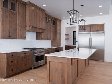 Thoughtfully oriented, this new custom home is designed around on Teton Reserve in Idaho - for sale on GolfHomes.com, golf home, golf lot