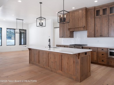 Thoughtfully oriented, this new custom home is designed around on Teton Reserve in Idaho - for sale on GolfHomes.com, golf home, golf lot