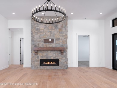 Thoughtfully oriented, this new custom home is designed around on Teton Reserve in Idaho - for sale on GolfHomes.com, golf home, golf lot