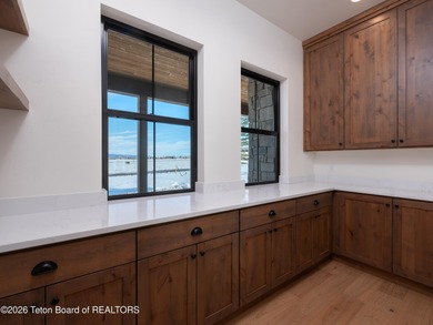 Thoughtfully oriented, this new custom home is designed around on Teton Reserve in Idaho - for sale on GolfHomes.com, golf home, golf lot